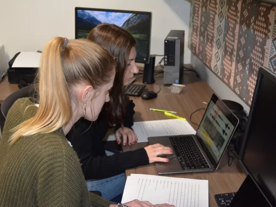 Two undergraduates looking at a spectagram on a computer screen