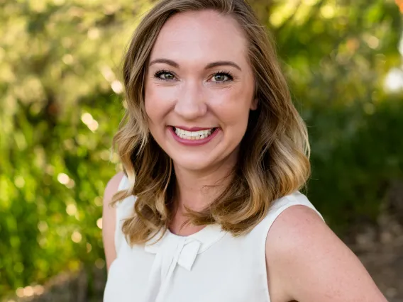 Headshot of Sarah Cretcher smiling at the camera