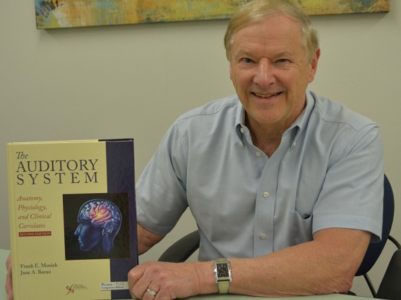 Dr. Frank Musiek with his new textbook