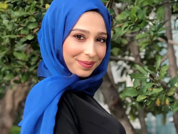 Headshot of Fatima Jebahi smiling and looking over right shoulder