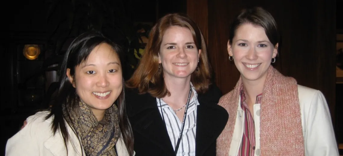 Three women looking at the camera smiling