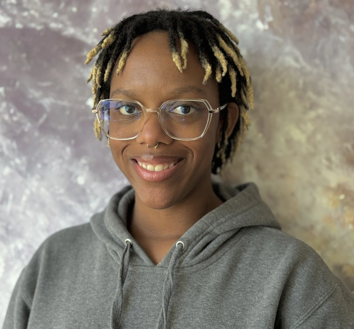 Headshot of Selena Hopkins-Morand smiling at camera