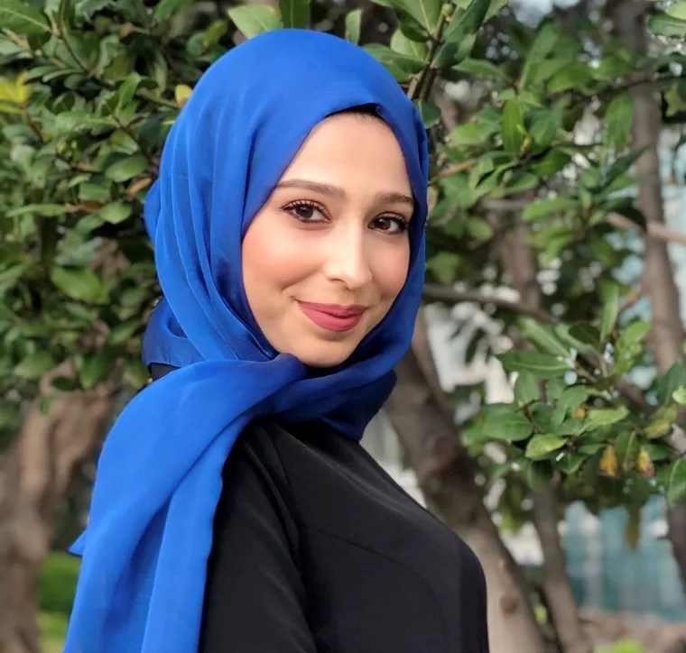 Headshot of Fatima Jebahi smiling and looking over right shoulder