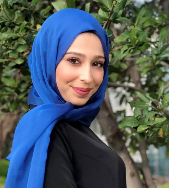 Headshot of Fatima Jebahi smiling and looking over right shoulder