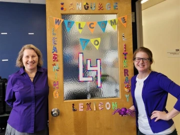 L4 Lab photo- posing by a door