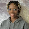 Headshot of Selena Hopkins-Morand smiling at camera