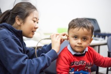 Graduate clinician works with a child